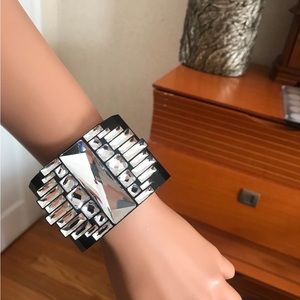 Swarovski bangle bracelet with large crystals in black matt tone setting. Sz M